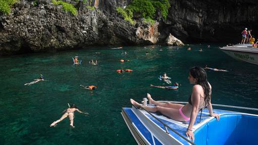 This photo taken on April 8, 2018 shows tourists snorkelling in the water nearby Maya Bay, on the southern Thai island of Koh Phi Phi.